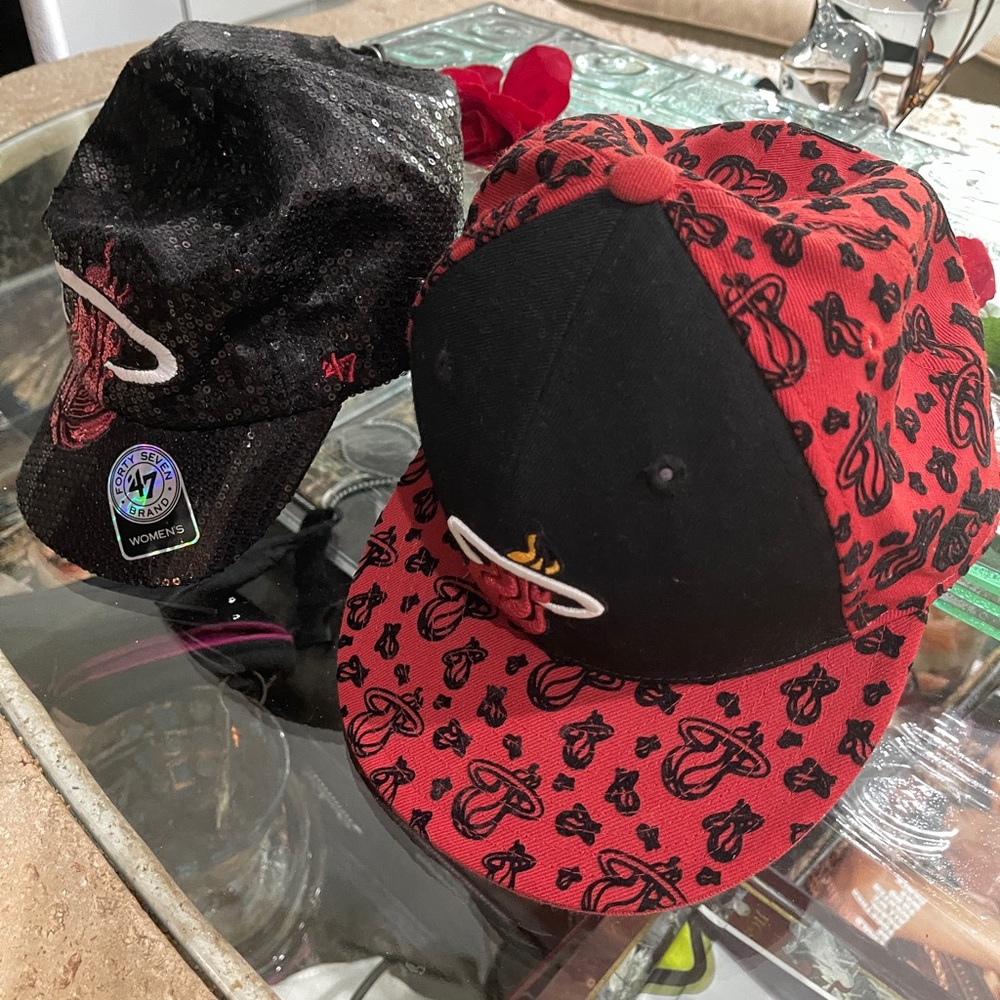 Two new adult Miami Heat caps!  Never worn and in perfect shape. Cleaning out